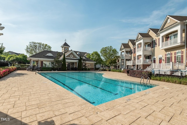 view of swimming pool with a patio