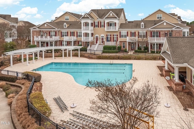 view of pool with a patio and a pergola