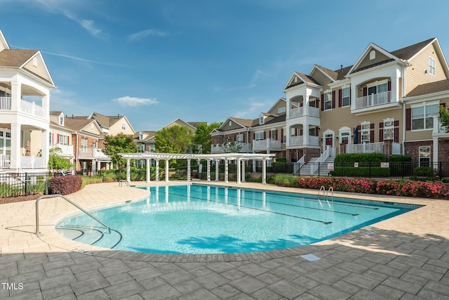 view of swimming pool with a pergola and a patio