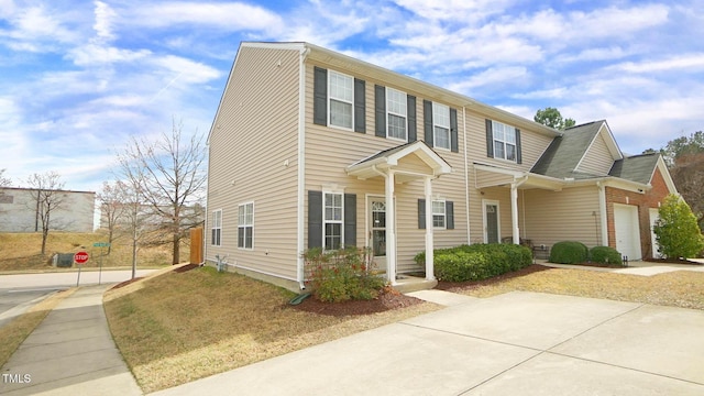 view of front of property featuring an attached garage and driveway