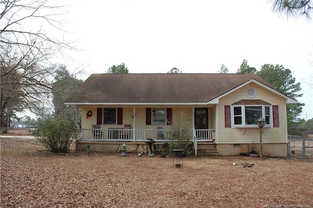 single story home featuring crawl space and a porch