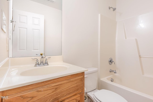 full bathroom featuring vanity, tub / shower combination, and toilet