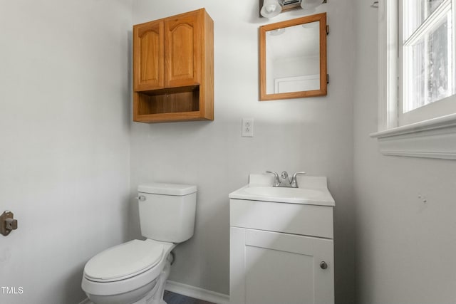 bathroom with toilet and vanity