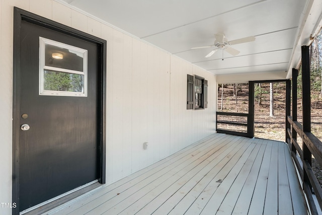 wooden deck with ceiling fan