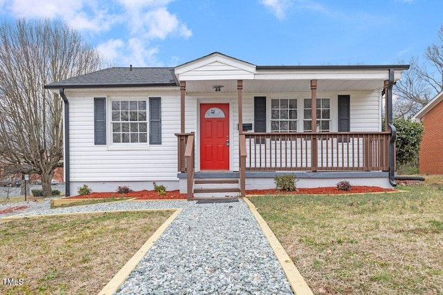 view of front of home featuring a porch and a front lawn