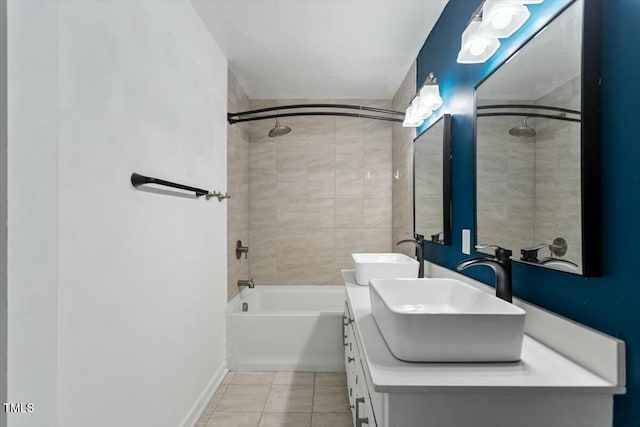 bathroom featuring tile patterned floors, vanity, and tiled shower / bath combo