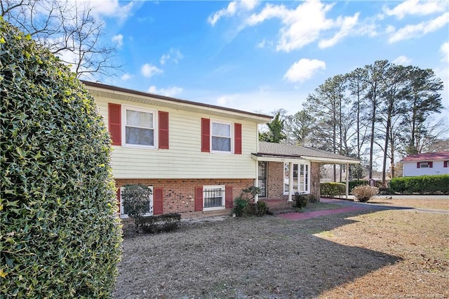 tri-level home with brick siding