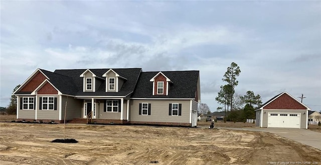 cape cod house with a garage