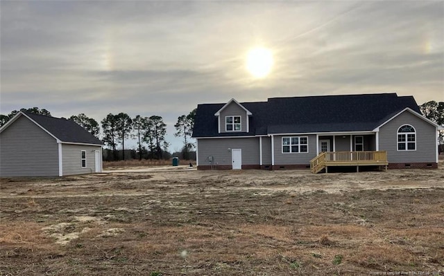 view of front of property featuring a wooden deck