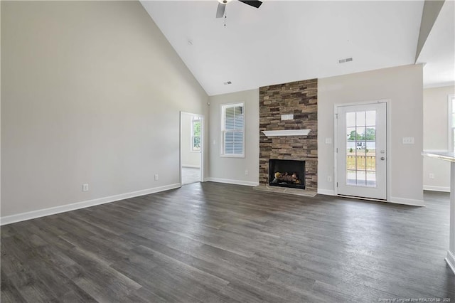 unfurnished living room with a healthy amount of sunlight, high vaulted ceiling, a ceiling fan, and visible vents