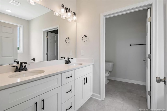 full bathroom featuring visible vents, a sink, double vanity, and toilet