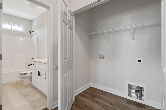 washroom with washer hookup, laundry area, electric dryer hookup, visible vents, and baseboards