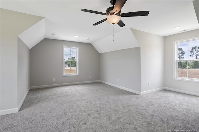 bonus room with baseboards, carpet, a ceiling fan, and lofted ceiling