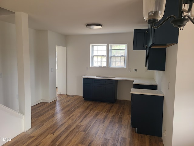 kitchen with dark hardwood / wood-style floors