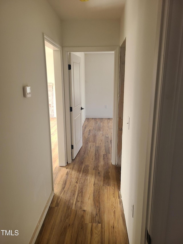 corridor featuring hardwood / wood-style flooring