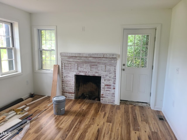 unfurnished living room with hardwood / wood-style floors