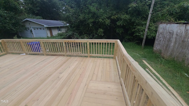 wooden deck with a garage