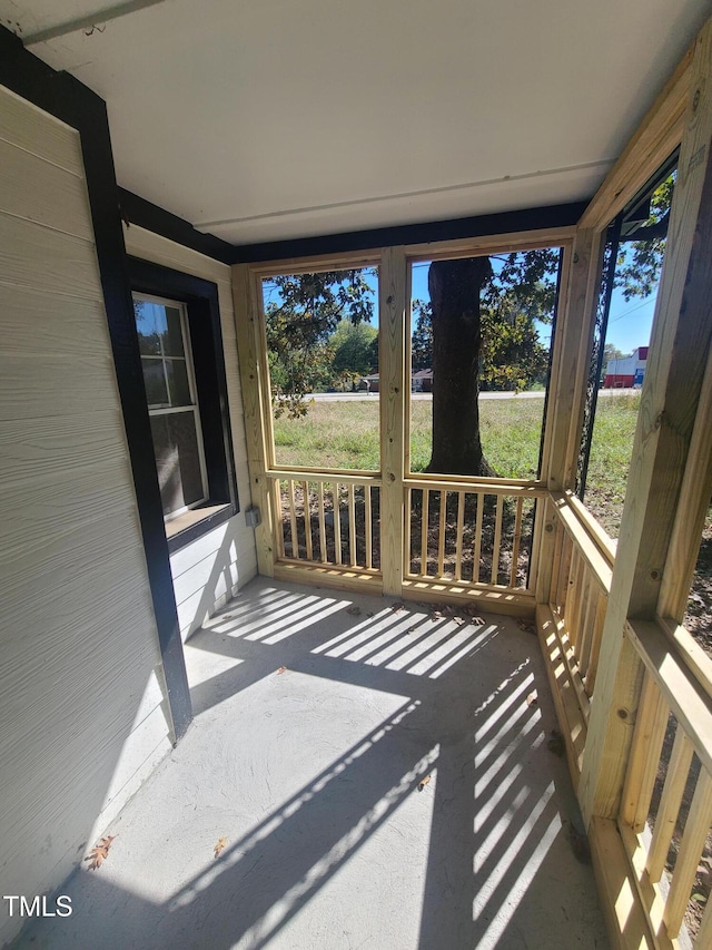 sunroom / solarium featuring a healthy amount of sunlight