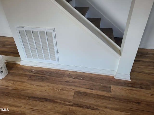 stairs with hardwood / wood-style flooring