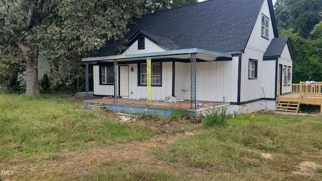 rear view of property with a porch