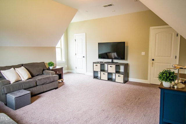 carpeted living area featuring lofted ceiling, visible vents, and baseboards