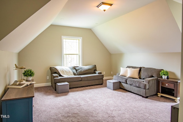 living area with vaulted ceiling, carpet flooring, and baseboards