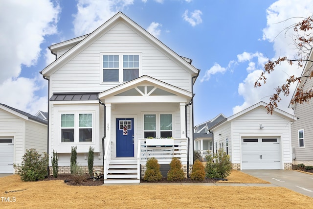 view of front facade with a garage and covered porch