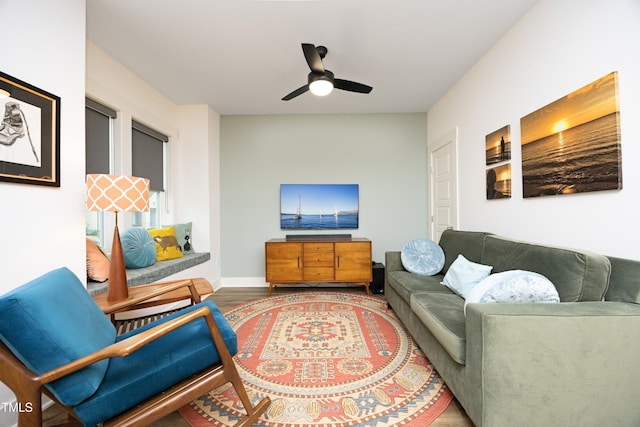 living room with hardwood / wood-style floors and ceiling fan