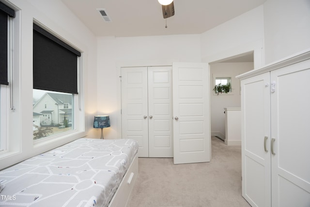 carpeted bedroom featuring a closet