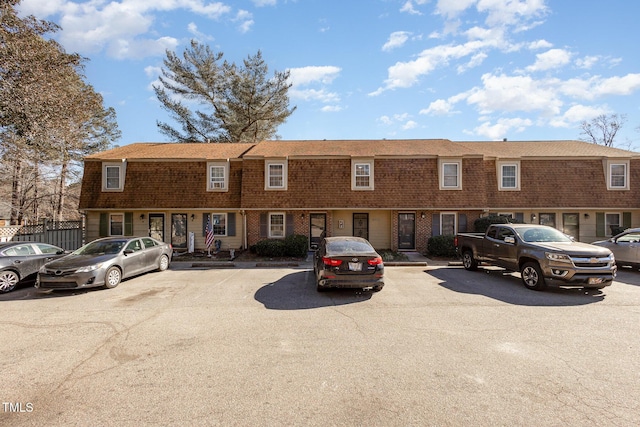 view of property with uncovered parking