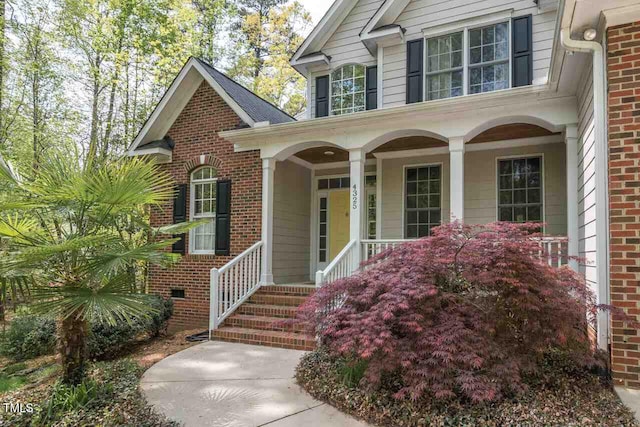 entrance to property featuring a porch