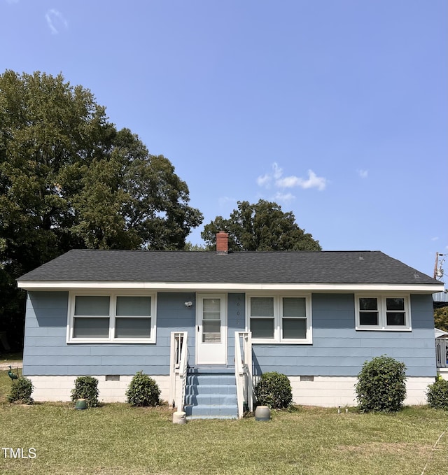 single story home featuring a front yard