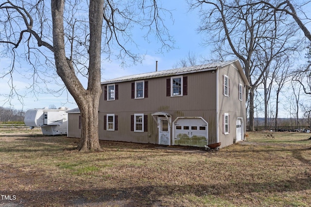 view of front of home featuring a garage and a front yard