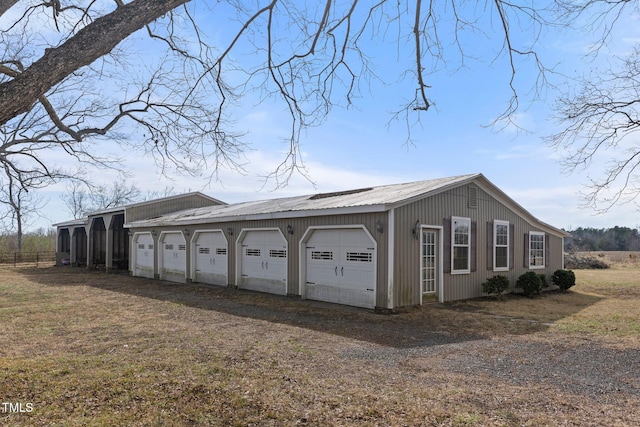 view of side of home featuring a garage