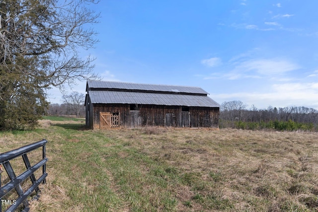view of outbuilding featuring a rural view