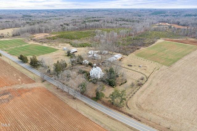 birds eye view of property with a rural view