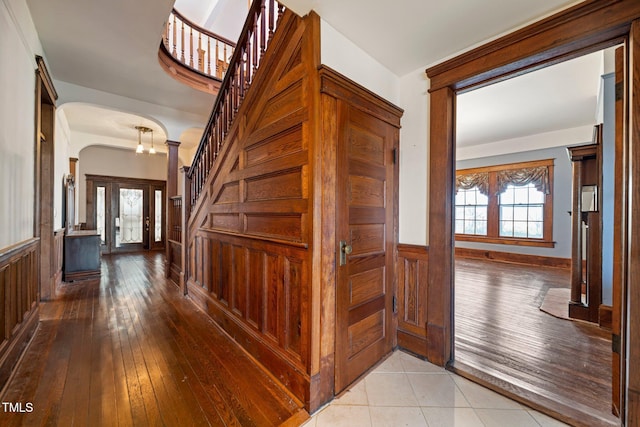 hall featuring light tile patterned floors