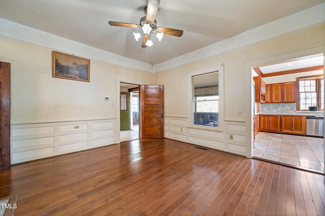 interior space with ceiling fan and light wood-type flooring