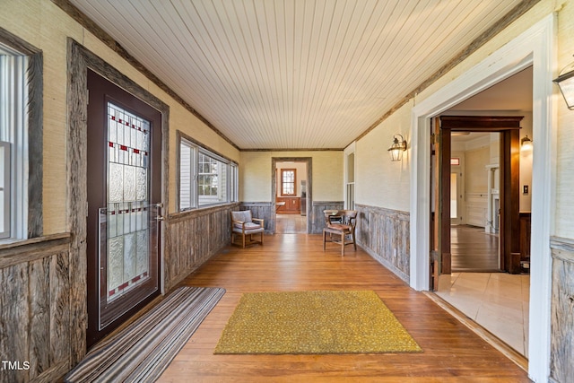 unfurnished sunroom with wooden ceiling