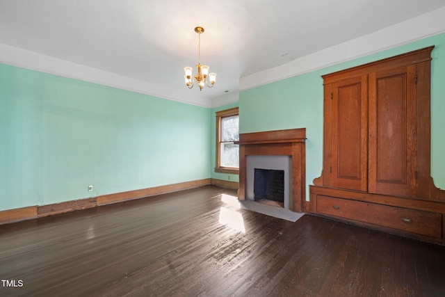 unfurnished living room with dark wood-type flooring and a chandelier