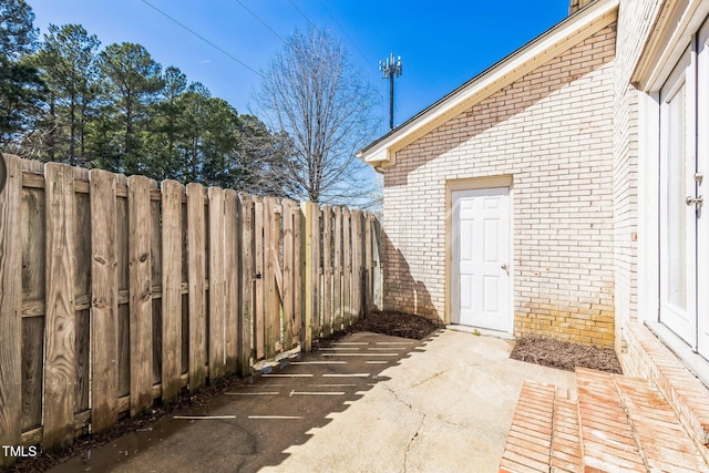 view of patio with fence