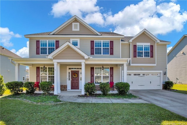 view of front of property with a garage, a front yard, and covered porch