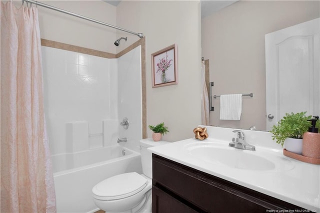 full bathroom with vanity, shower / tub combo, and toilet