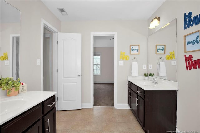 bathroom with vanity and tile patterned flooring