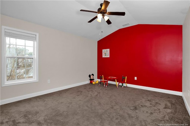 additional living space featuring vaulted ceiling, carpet floors, and ceiling fan