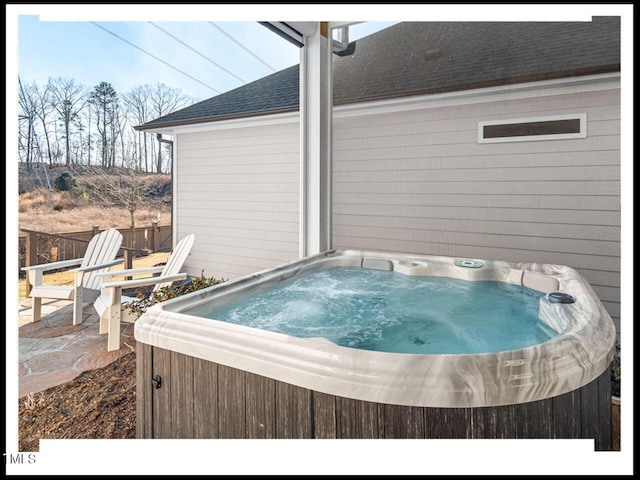 view of pool with a patio area and a hot tub