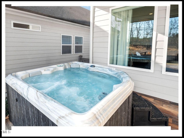 exterior space featuring a hot tub