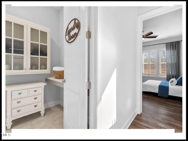 interior space featuring light wood-style floors and baseboards