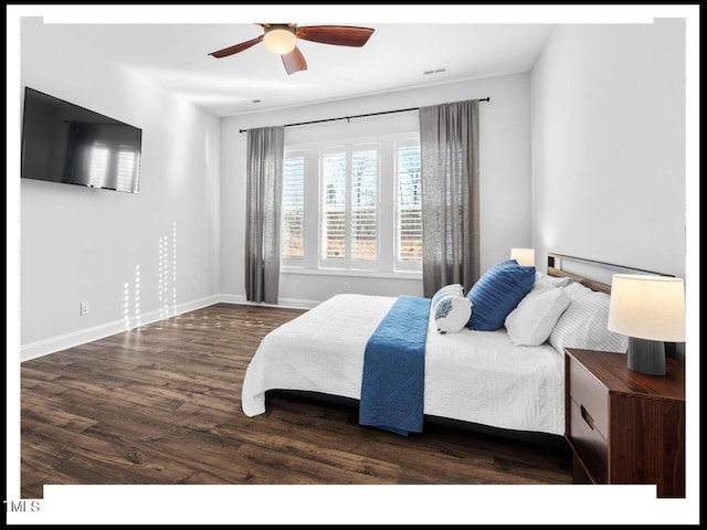 bedroom featuring ceiling fan, visible vents, baseboards, and wood finished floors