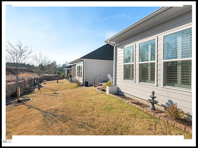 view of yard with fence